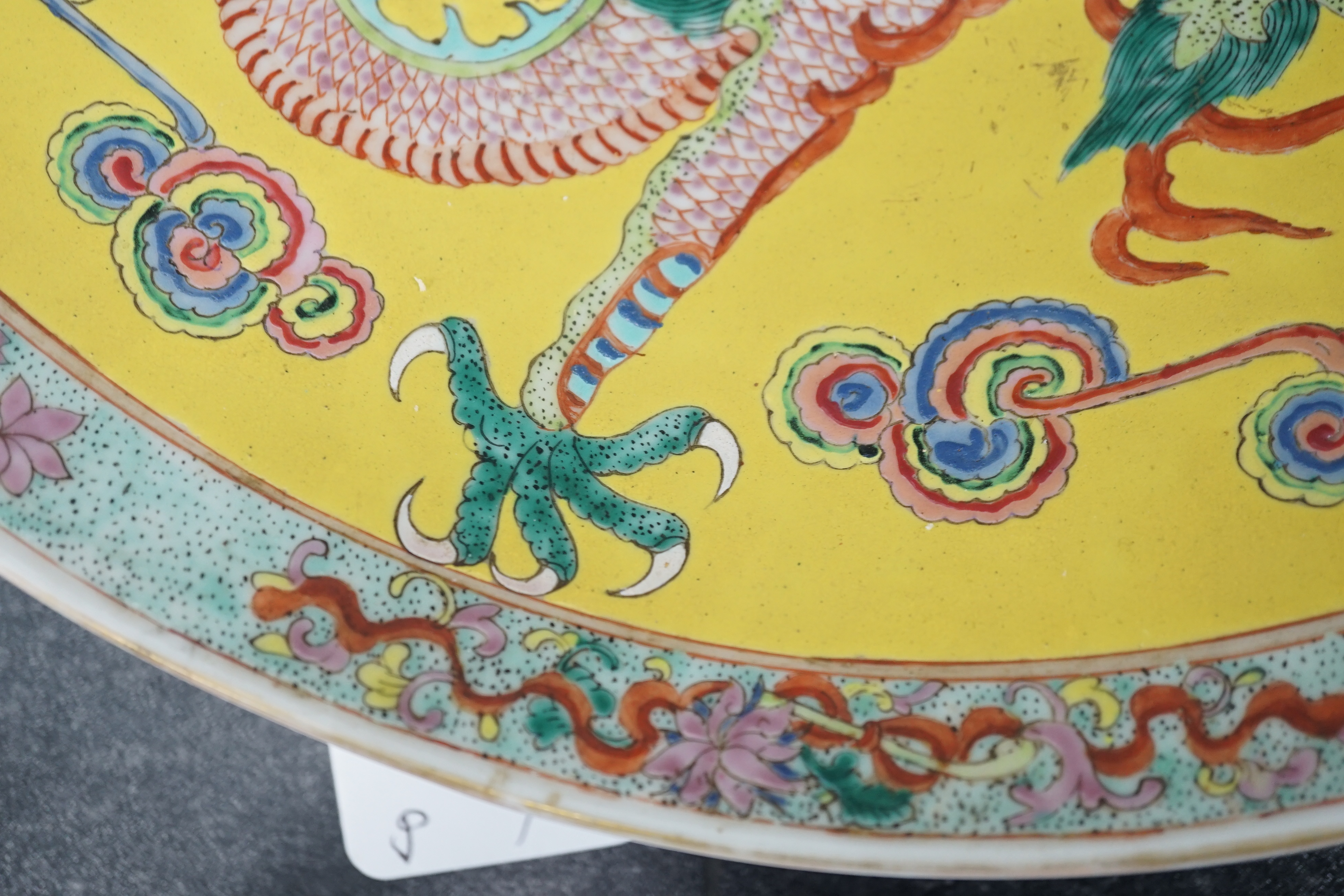 A Chinese yellow ground ‘dragon’ dish, late 19th century, minor damage